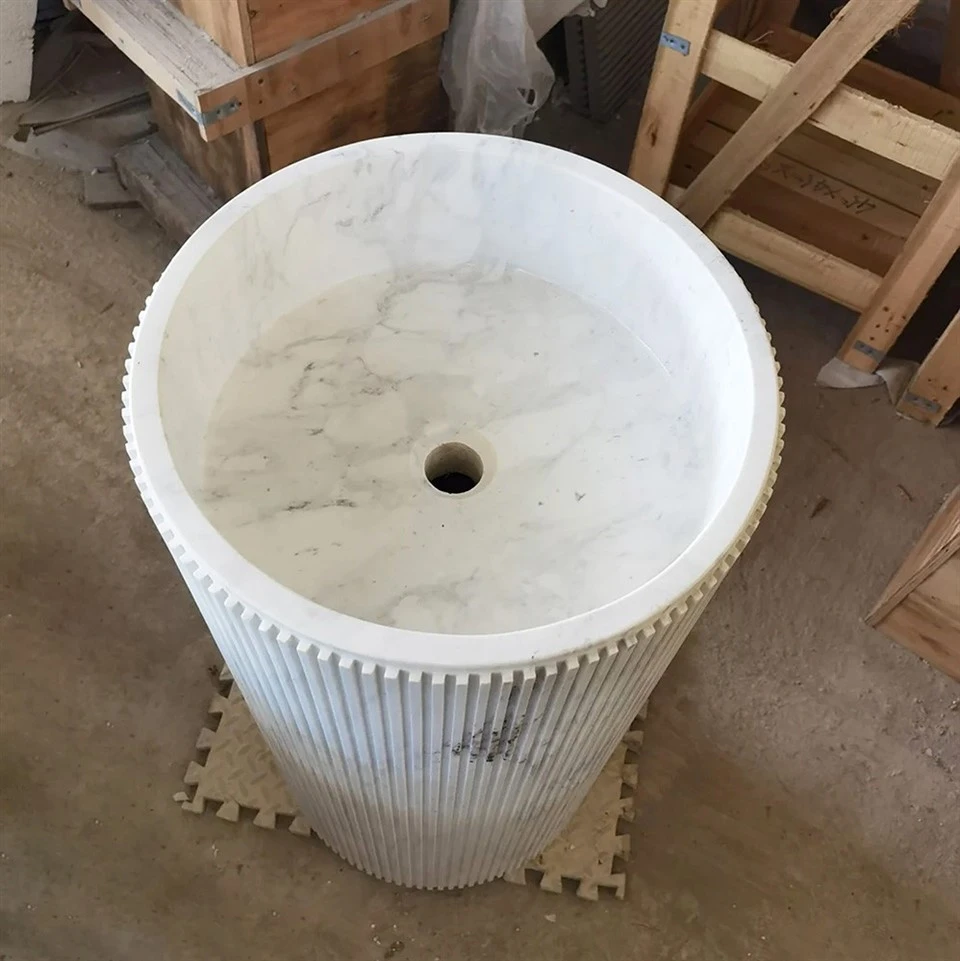 white marble pedestal basin